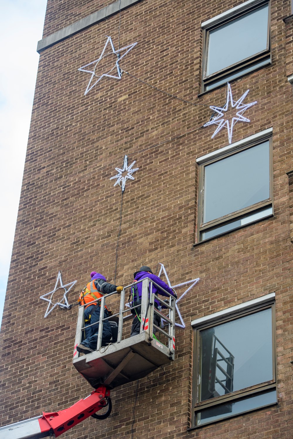Light-up blue star motifs displayed outside County Hospital designed by Fizzco Projects.