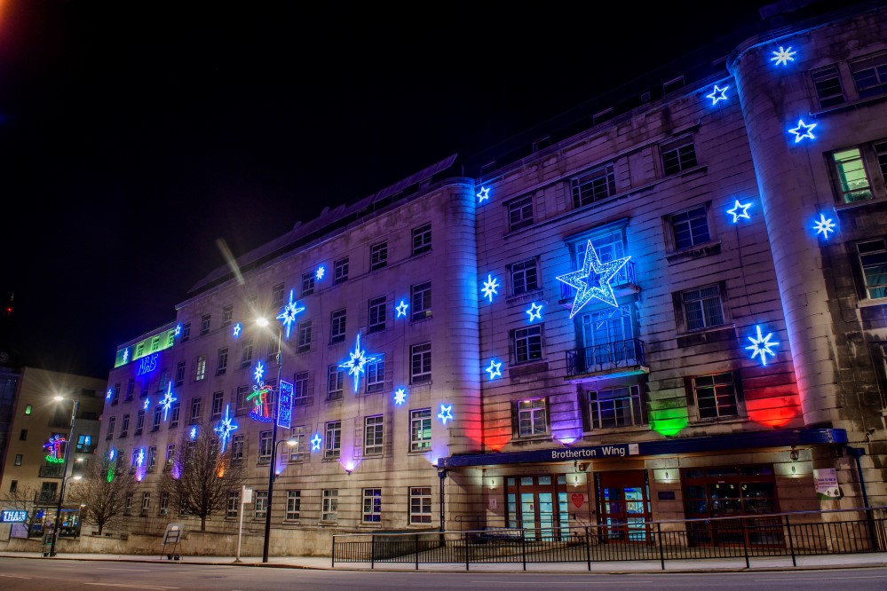 Light-up blue star motifs displayed outside Leeds Hospital for the Christmas season.