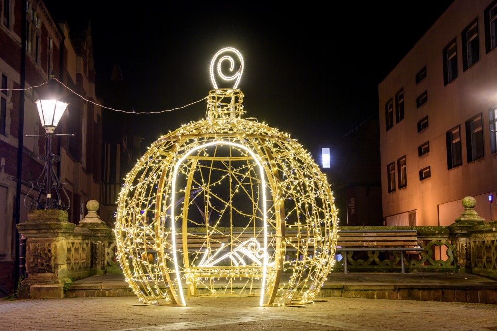 Gold light up 3D bauble motif displayed on Lincoln high street.