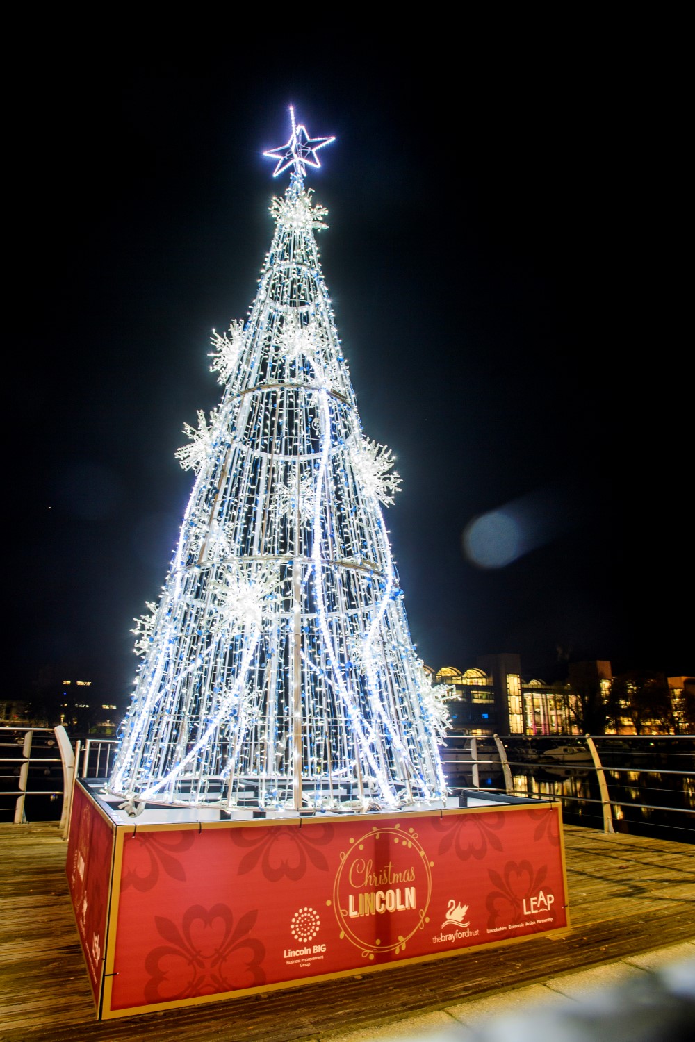 Bright white light up cone Christmas Tree displayed in the Brayford in Lincoln.