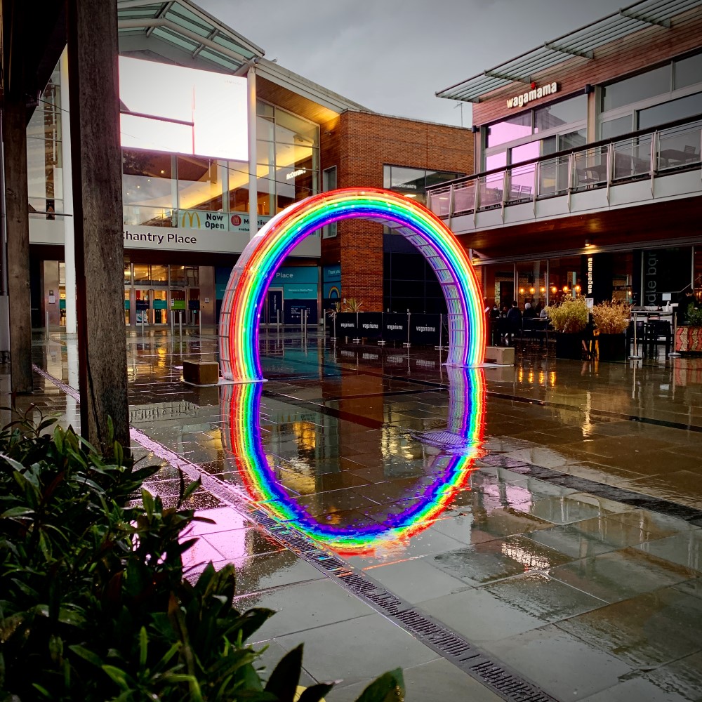 A rainbow Arch Motif displayed outside the entrance to Chantry Place Shopping Centre in Norwich.