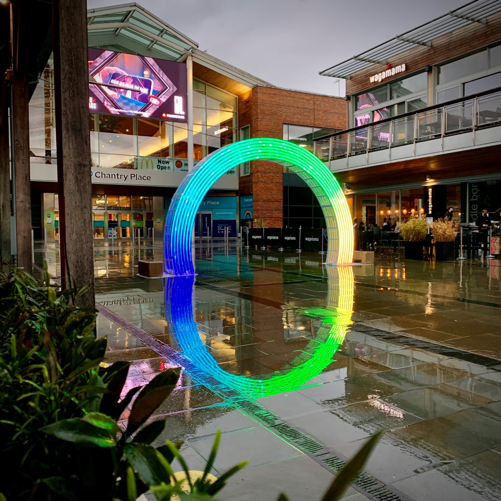 A rainbow Arch Motif displayed outside the entrance to Chantry Place Shopping Centre in Norwich.