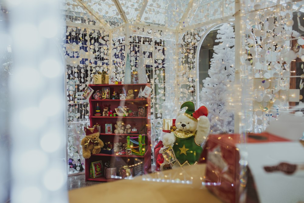 White Winter Wonderland Grotto display featuring teddy bears and toys as part of a shopping centre installation designed by Fizzco Projects.