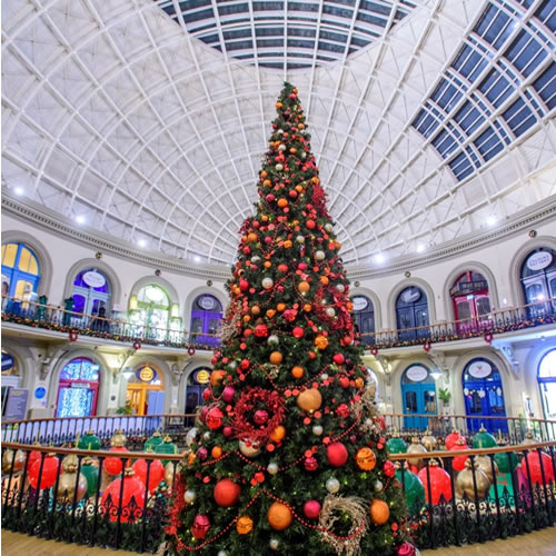 Large-scale Christmas Tree designed by Fizzco Projects at Leeds Corn Exchange Shopping Centre for the Christmas season.