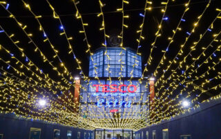 Warm White Lights by Fizzco Projects displayed outside Tesco for the Christmas season.
