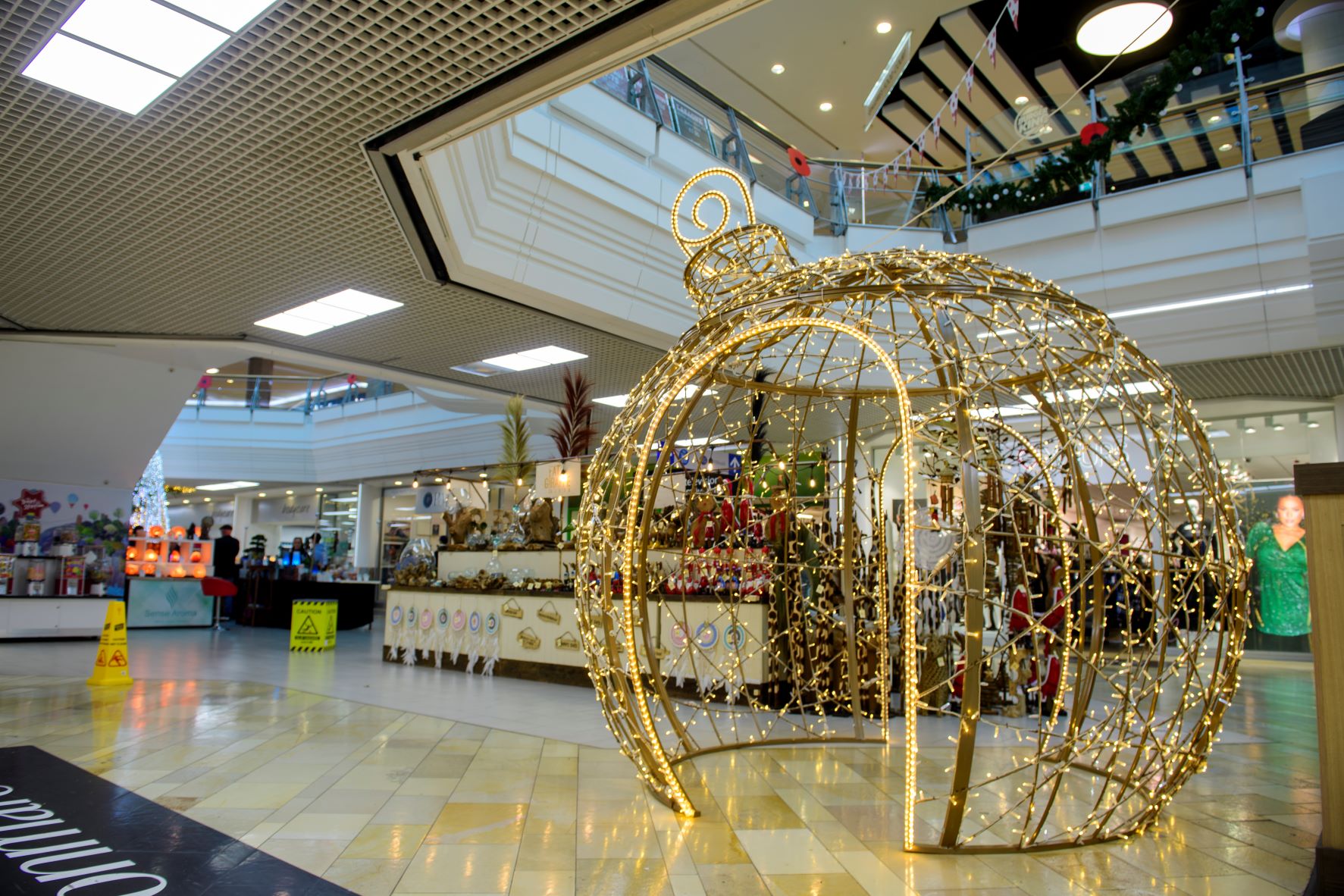 Light-up gold bauble motif displayed at The Galleries Shopping Centre in Bristol.