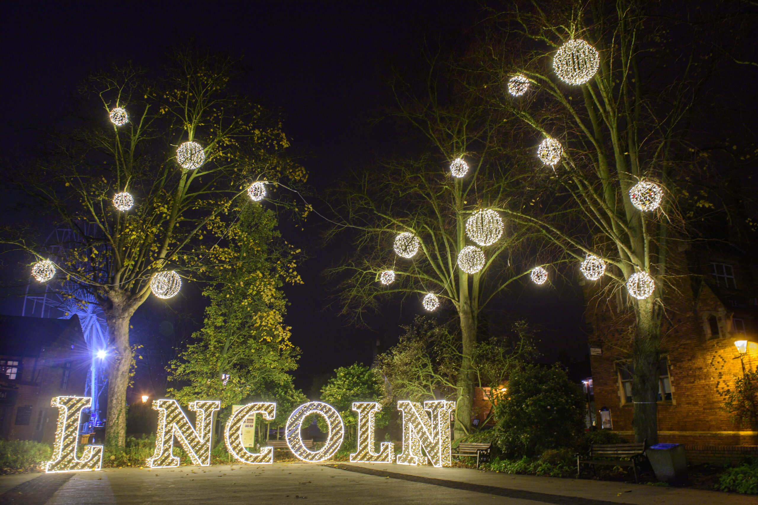Light-up Lincoln selfie-point and 3D bauble motifs by Fizzco Projects displayed on trees in Lincoln City Centre for the Christmas period.