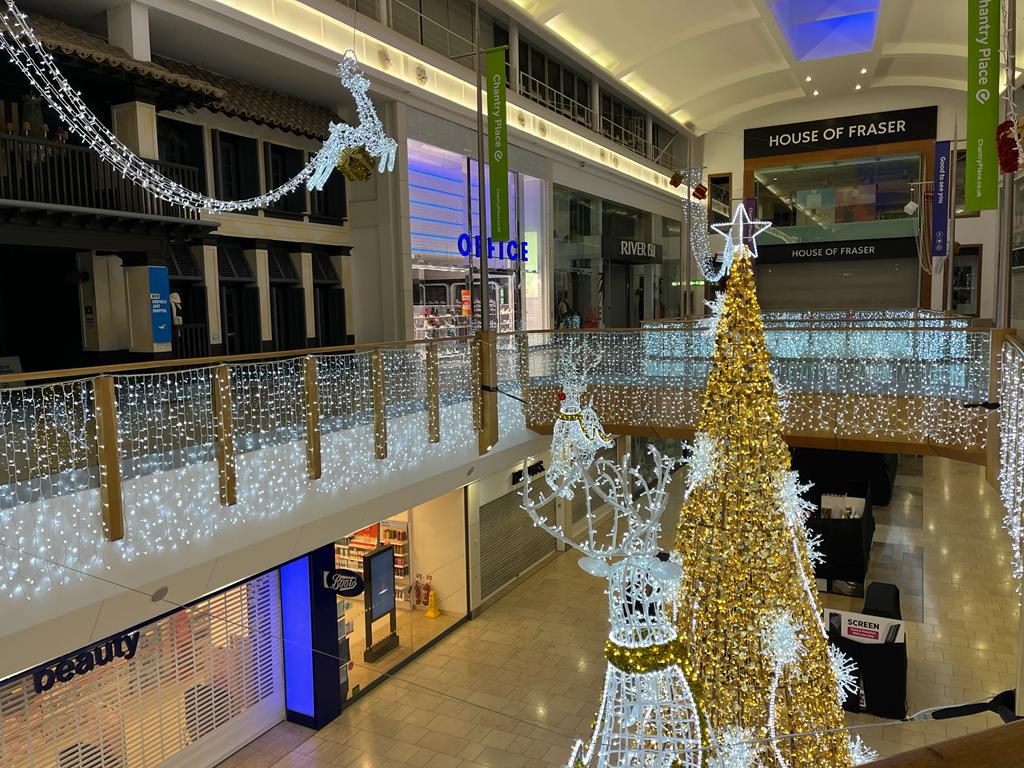 An installation at Chantry Place Shopping Centre featuring a luxurious gold and white Christmas display designed by Fizzco Projects.