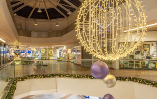 Garlands and Wreaths displayed in a Shopping Centre for a Christmas display designed by Fizzco Projects.